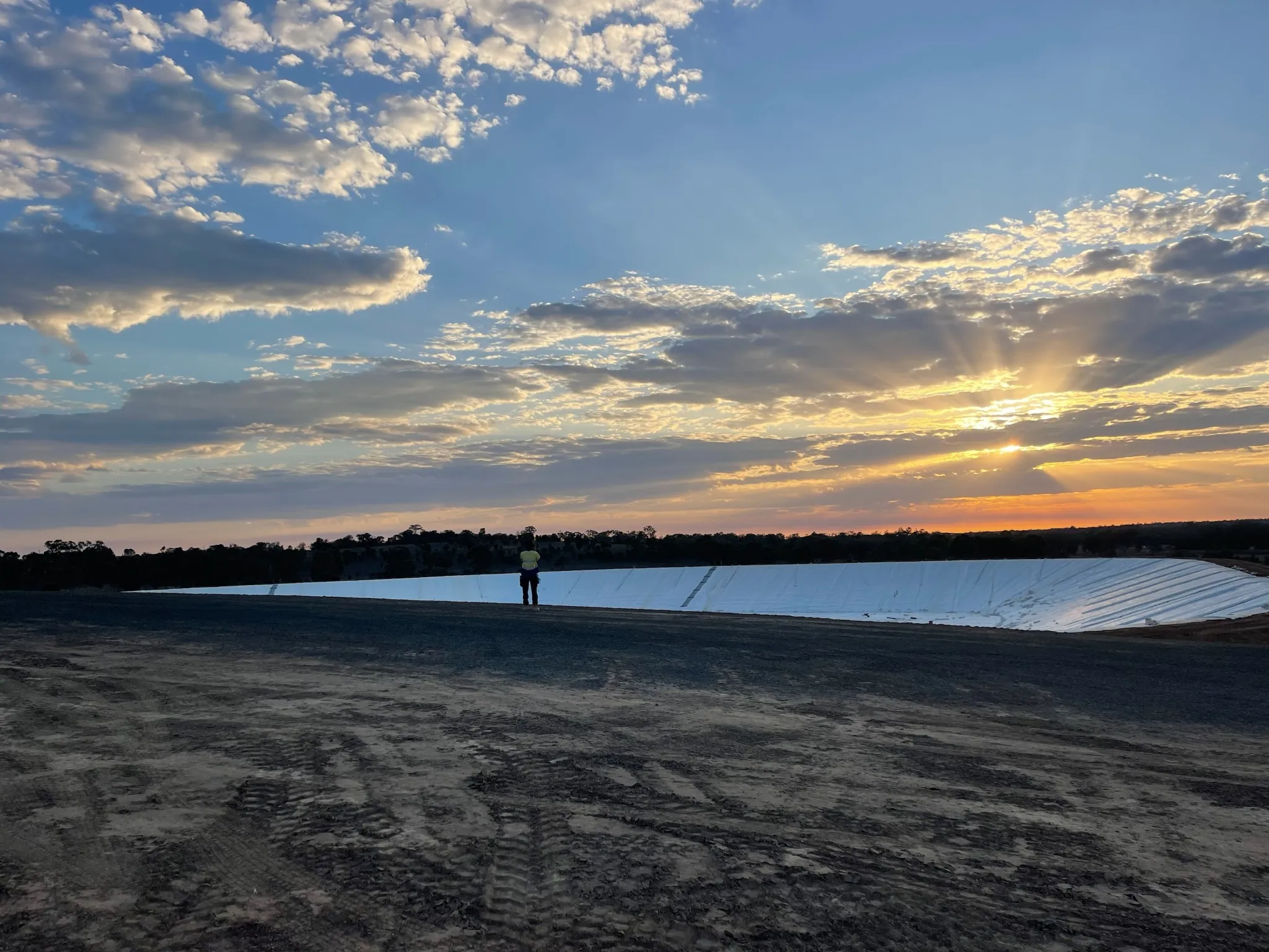 Lined containment infrastructure at dusk