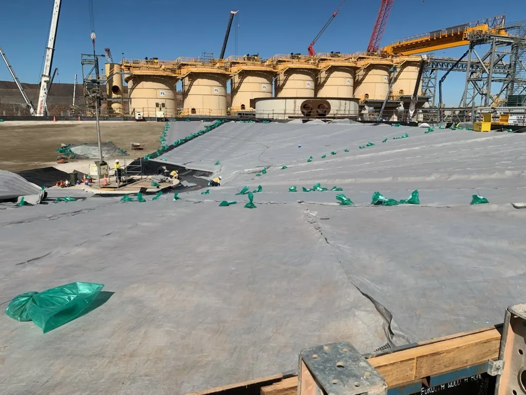 Geomembrane liner installation across an industrial containment area