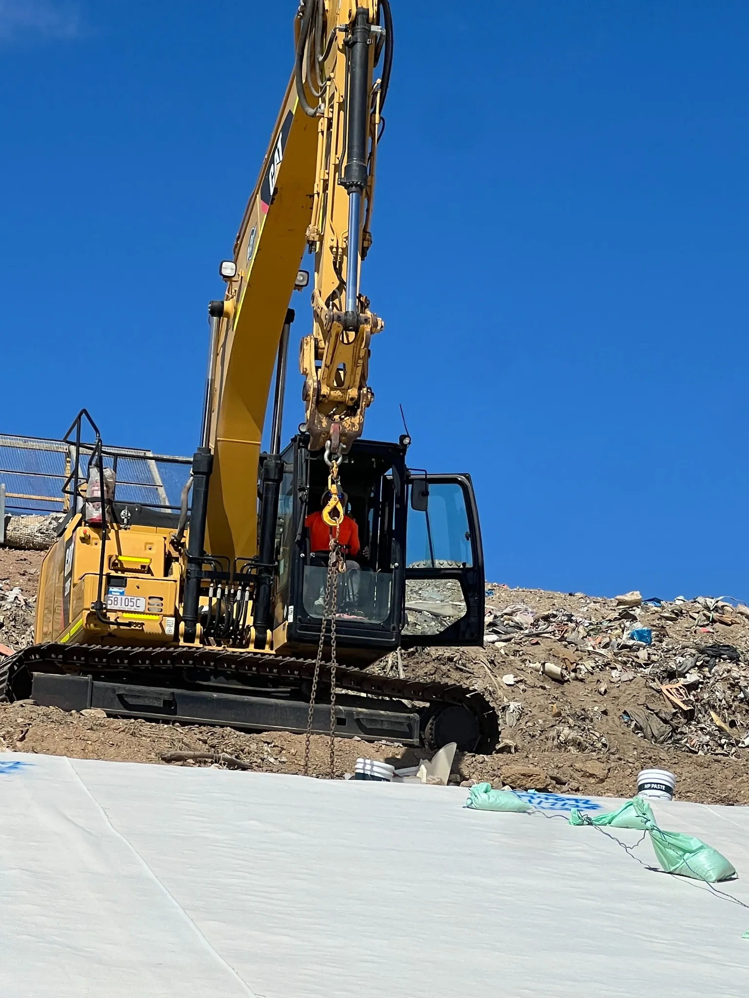 HDPE liner panels deployed across a landfill cell base